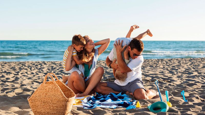 A family playing on the beach